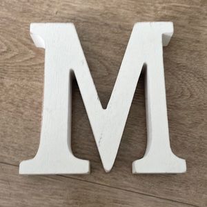 Off white wooden letter “M”